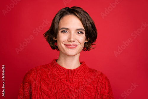 Photo of young attractive woman happy positive smile enjoy christmas time isolated over red color background