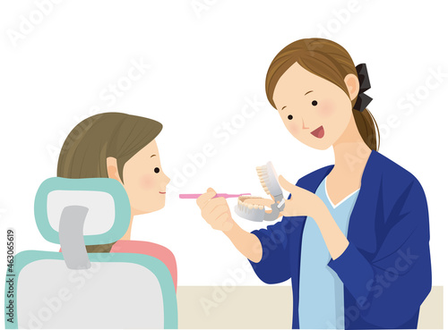 歯磨き指導をする歯科衛生士の女性