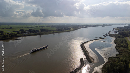 Inland container vessel on River Lek aerial view, the Netherlands photo