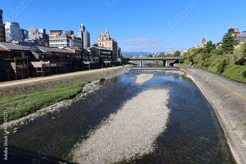 A cityscape of Kyoto in Japan 日本の京都の一都市風景 :the Kamo River flowing through Kyoto and Shijo-ohashi Bridge 京都を貫流する鴨（賀茂）川と四条大橋 photo