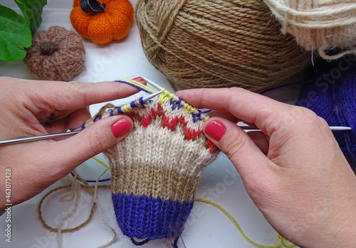 The process of knitting a socks. Knitting of a jacquard pattern on knitting needles