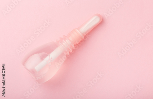 vaginal enema on pink baclground. Treatment of gynecological diseases. Pump for feminine hygiene. Woman health. Contraception method douche, lavement. Medical birth control. Planning pregnancy