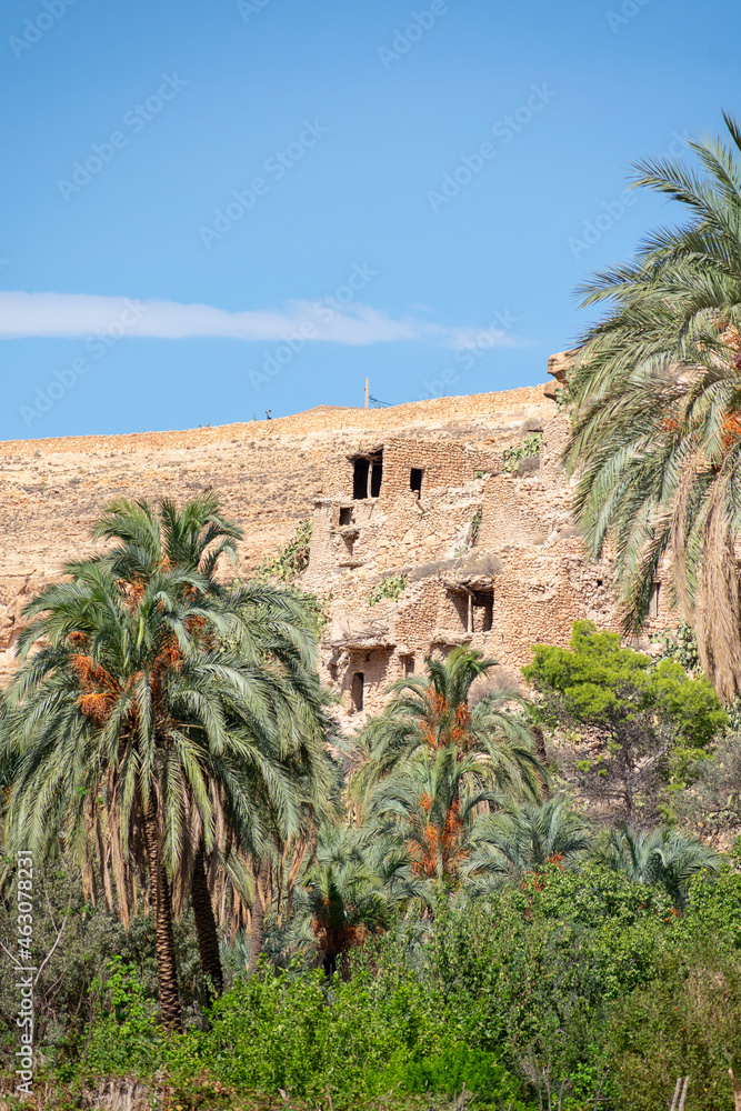 Scenic view of Old stone houses, Palm trees Oasis , Mountains from Ghoufi Canyon in the Aures region, Algeria