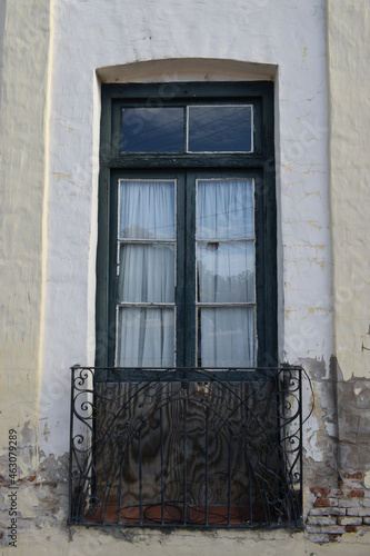 Balcony with window and door in San Antonio de Areco, Buenos Aires province, Argentina photo