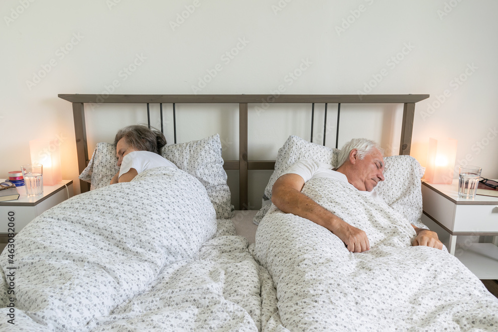 senior aging married couple man male and female woman sleep together in bed apartment sexual problems dysfunction senior aging married couple man male and female woman sleep together in bed apartment sexual problems dysfunction