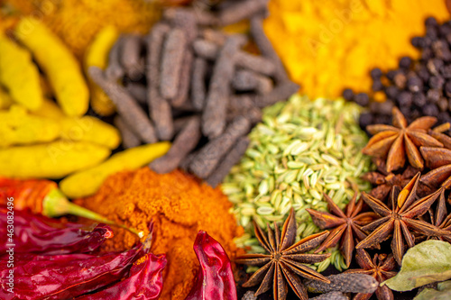 Various spices, peppers and herbs close-up top view. Eastern spice market. A set of peppers and spices for cooking.