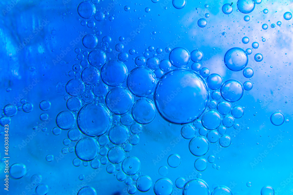 Water drops mixed with detergent on a color background
