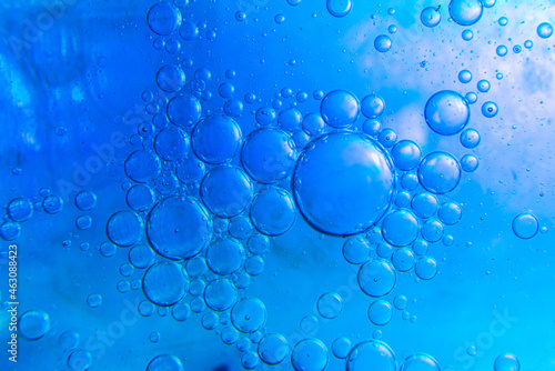 Water drops mixed with detergent on a color background