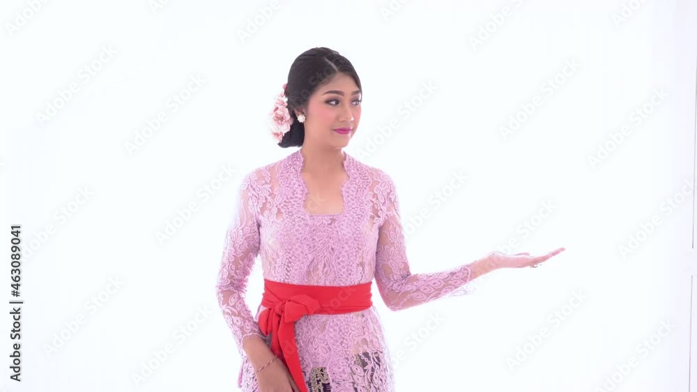 Young Balinese woman with presenting a product Young Balinese woman with presenting a product