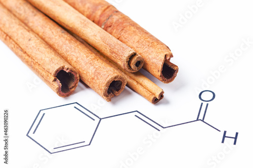 Aromatic cinnamon and Cinnamaldehyde, chemical structure and formula. photo