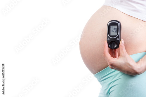 Pregnant woman with glucometer, diabetes during pregnancy