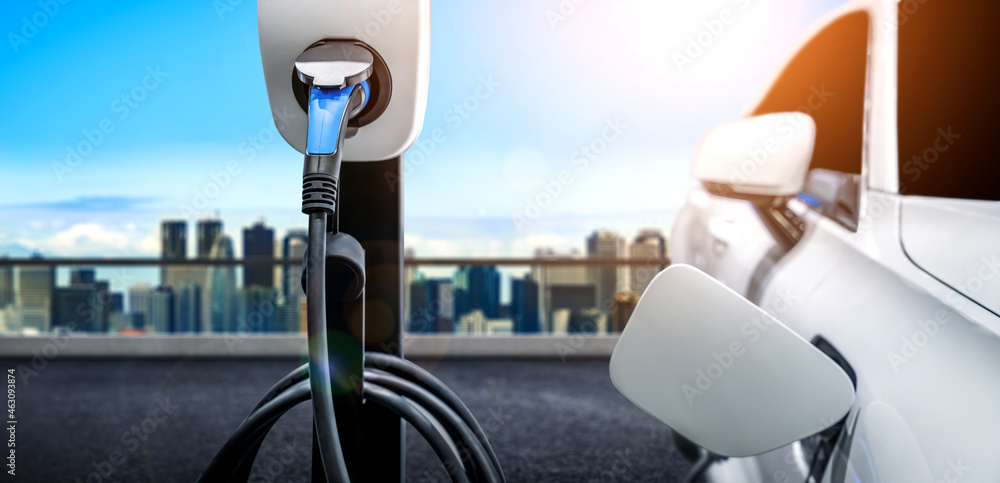 EV charging station for electric car in concept of green energy and eco power produced from sustainable source to supply to charger station in order to reduce CO2 emission . - obrazy, fototapety, plakaty 