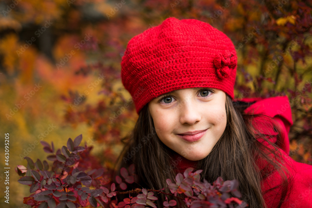 Beautiful girl in sunny autumn park. Child playing in park at autumn. Autumn mood. Beautiful girl in sunny autumn park. Child playing in park at autumn. Autumn mood.