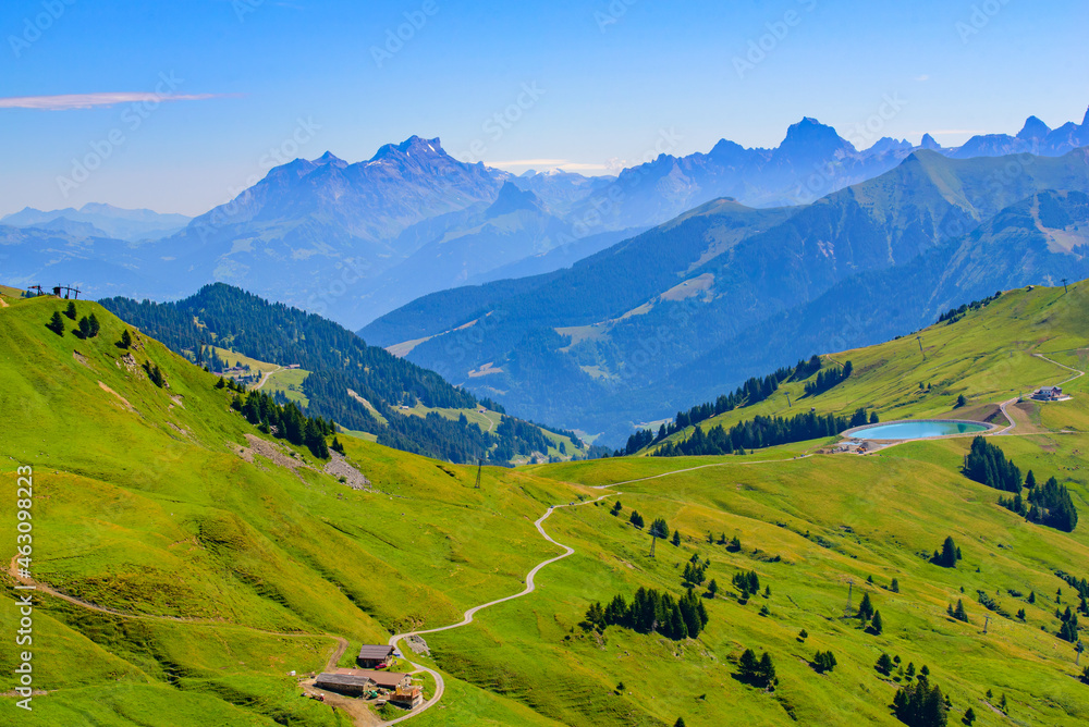 Landscape of mountains of Alps in summer with green meadow in Portes du Soleil, Switzerland, Europe