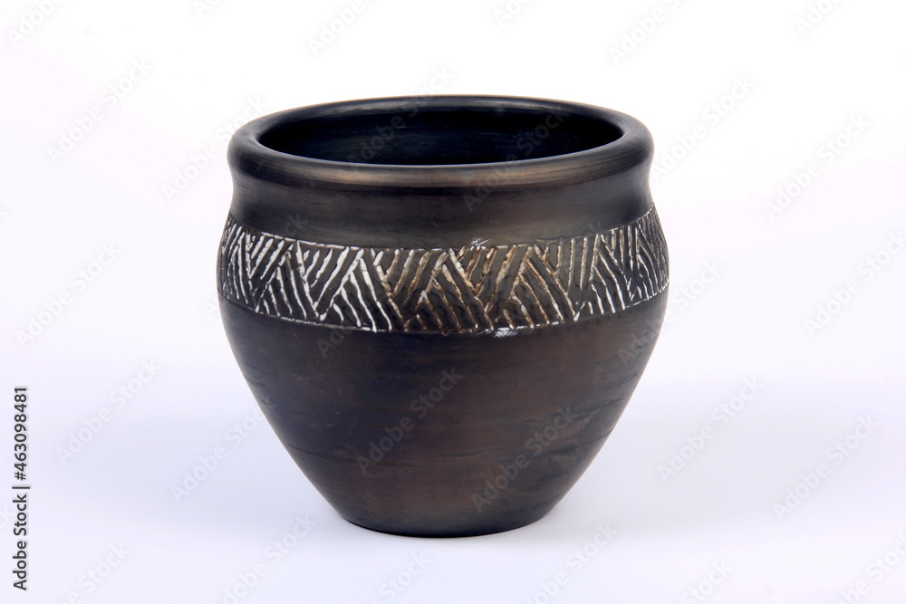 Small black empty ceramic bowl isolated on white.black clay pot on a white background Small black empty ceramic bowl isolated on white.black clay pot on a white background