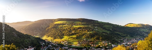 Sun rise over landscape with mountains and view of La Bresse, France
