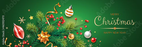 Horizontal banner with colorful Christmas symbols. Christmas tree, berries, balls, serpentine and snowflakes on green background.