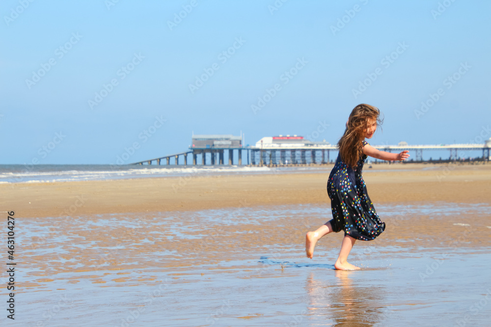 Fototapeta premium person walking on the beach