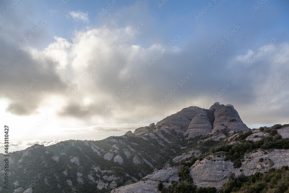 Picturesque landscape with mountains. Landscape and beautiful sunset on Montserrat mountain. Rock formations and cliffs in the Catalan Natural Park of Montserrat. Barcelona, Catalonia, Spain