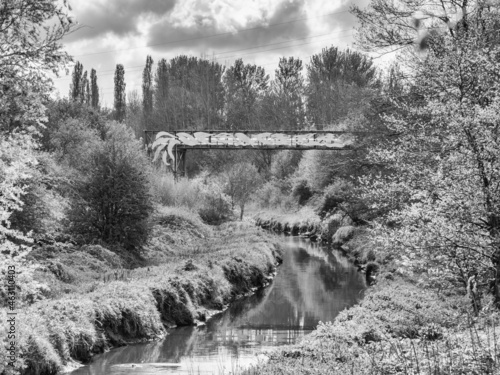 Unusual decroative bridge over river at Witton Mill, Northwich, Cheshire, UK photo