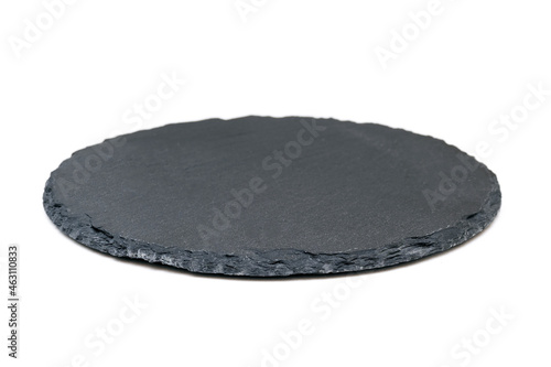 Natural black stone slate as a tray. Side view of slate board isolated on white