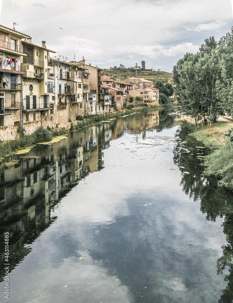 Beautiful views of the towns of Teruel with the reflection of their houses in the river