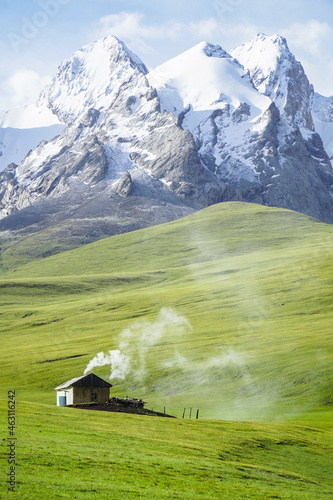 a lonely shepherd's house in alpine meadows at an altitude of 3500 m above sea level. With snowy mountains against a background of 5000m above sea level. photo