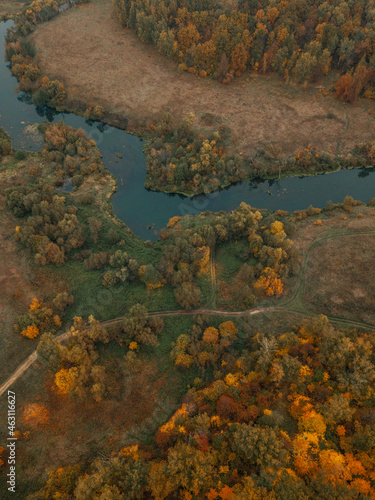 Aerial view of autumn landscape with forest and river