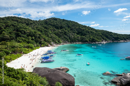 Similan island with tourists traveling on the beach in tropical sea © Mumemories
