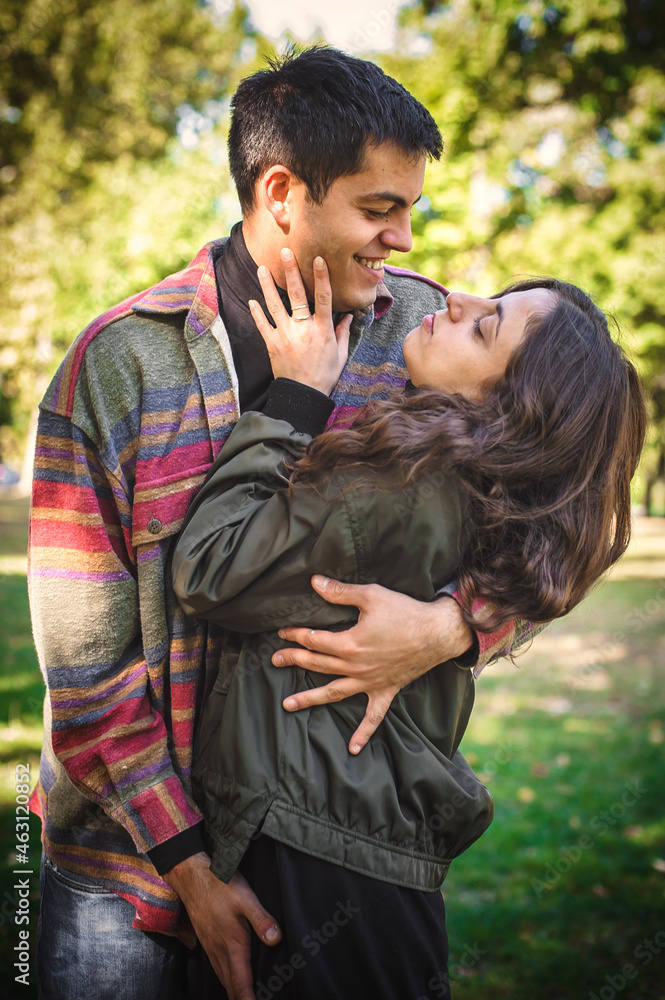 Fototapeta premium Cheerful and romantic couple hugging and enjoying in in love