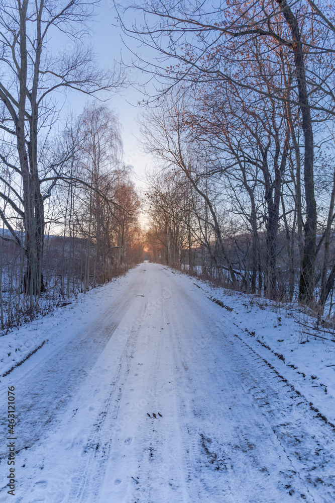 frozen path and winter sunset frozen path and winter sunset