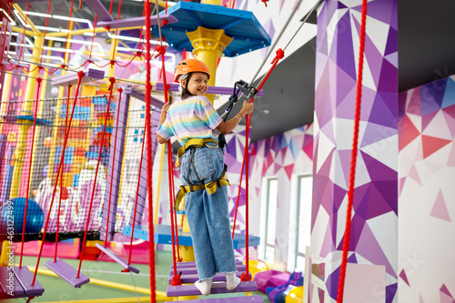 Little girl on zip line in entertainment center