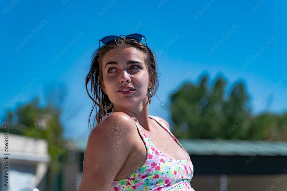 Relaxed woman in swimming pool spending afternoon