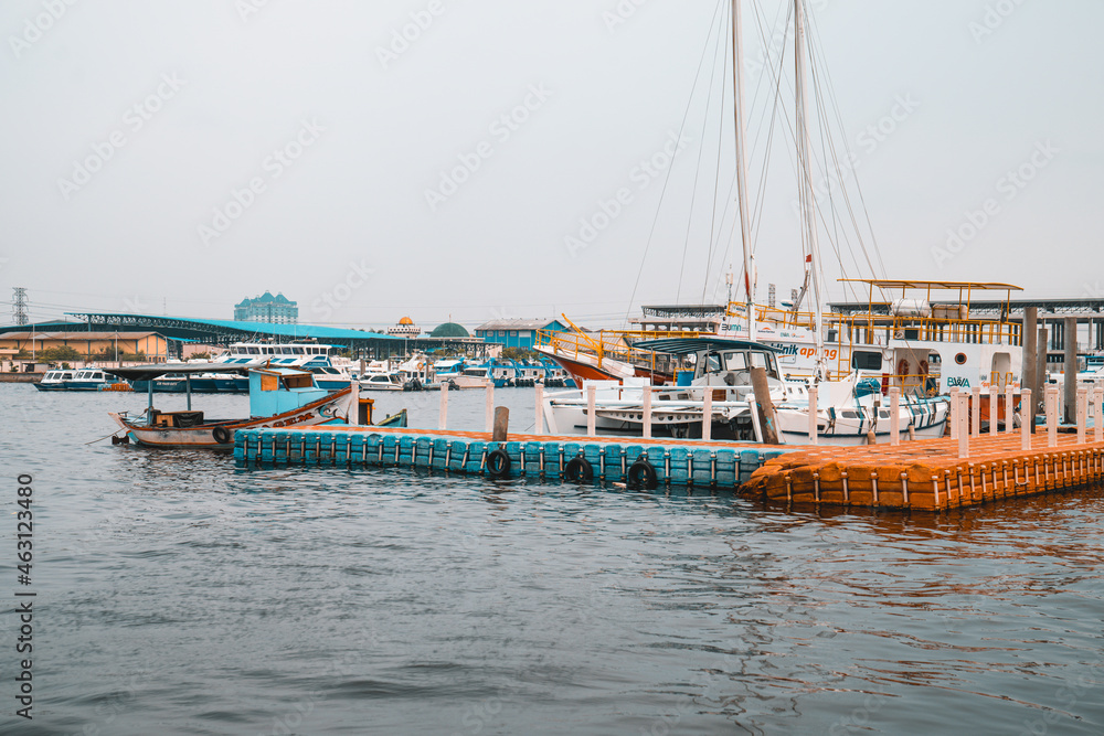 Port of Tanjung Priok on a gloomy day in Jakarta, Indonesia - obrazy, fototapety, plakaty 