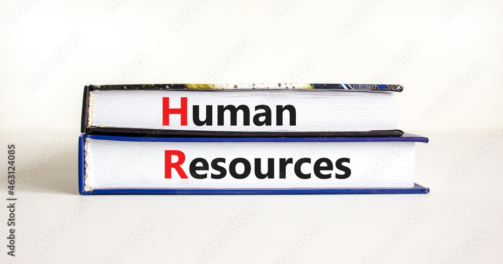 Human resources symbol. Concept words 'Human resources' on books on a beautiful white table, white background. Business and human resources concept.