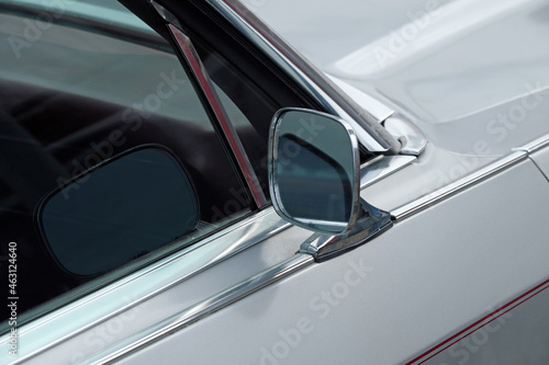 Partial view of a classic car with an old side mirror - Stockphoto 