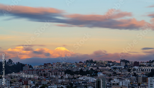 Long exposure cityscape of Quito at sunset with Cayambe volcano, Ecuador. © SL-Photography