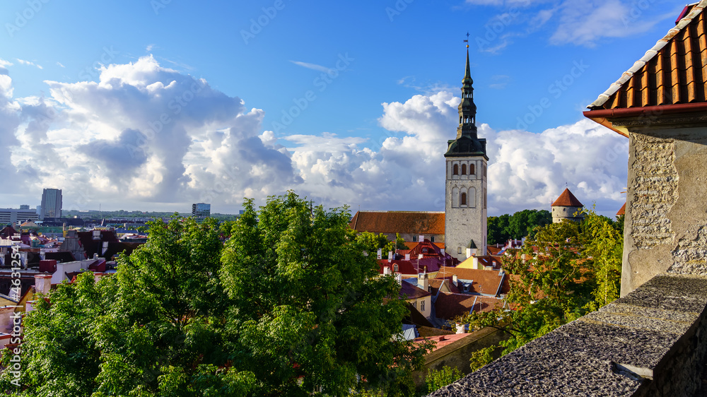 Panoramic view of the medieval city of Tallinn with huge white clouds.