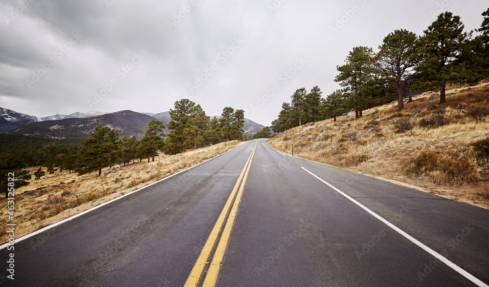 Fototapeta premium Empty asphalt road, color toning applied, Colorado, USA.