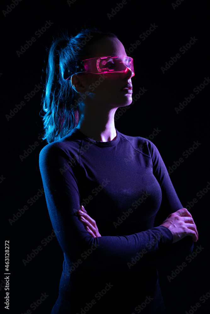 Concept of future technology or entertainment system, virtual reality. Female portrait lit by HUD interface Concept of future technology or entertainment system, virtual reality. Female portrait lit by HUD interface