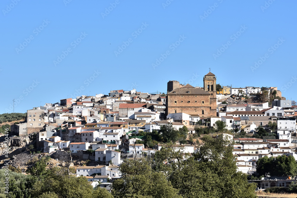View of the church Nuestra Señora de los Remedios (16th century) in the Granada town of Iznalloz (Spain)