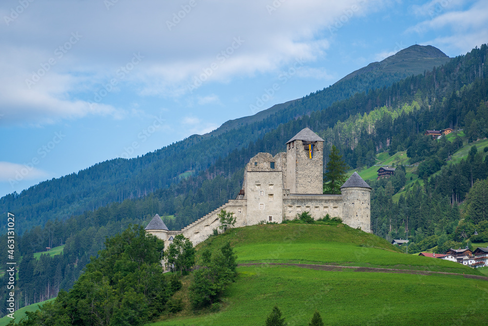View of the old castle among the forest on a mountain in Austria View of the old castle among the forest on a mountain in Austria
