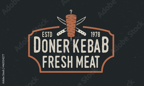 Doner Kebab vintage logo. Doner Kebab with kebab knives and vintage frame. Vintage hipster design with grunge texture. Vector illustration