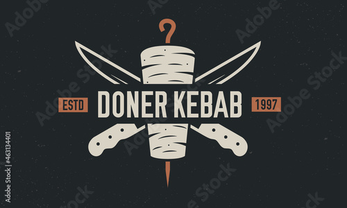 Doner Kebab, Shawarma logo, poster. Doner Kebab with kebab knives isolated on black background. Vector emblem template.