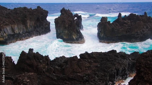 Waves Crashing Against The Black Basalt Lava Shelf at Pakulua Point, Waianapanapa State Park, Maui, Hawaii, USA photo