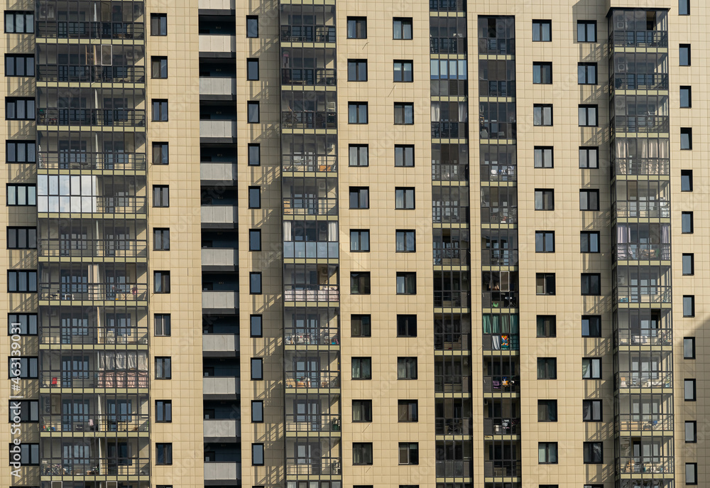 Windows of the residential building. Urban obsolete facade of house. The windows of building 
