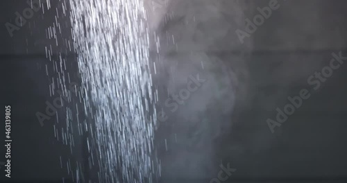 Water pouring from shower letting off steam
