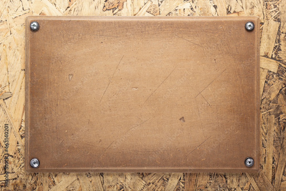 Fototapeta premium Nameplate or sign board at wooden background. Front view of name plate