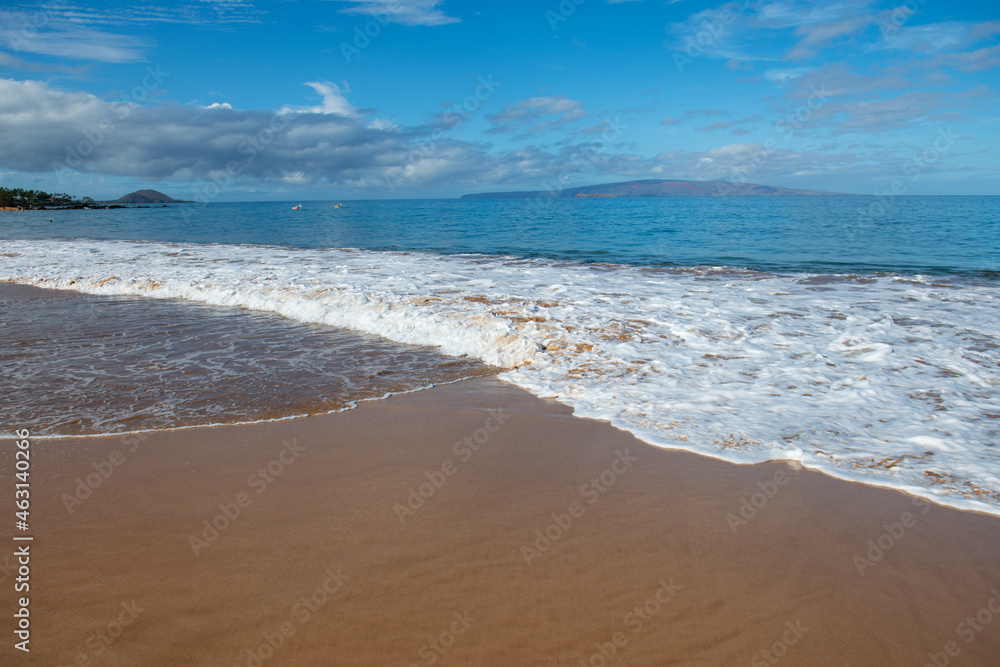 Beach background. Calm beautiful ocean wave on sandy beach. Sea view from tropical sea beach.