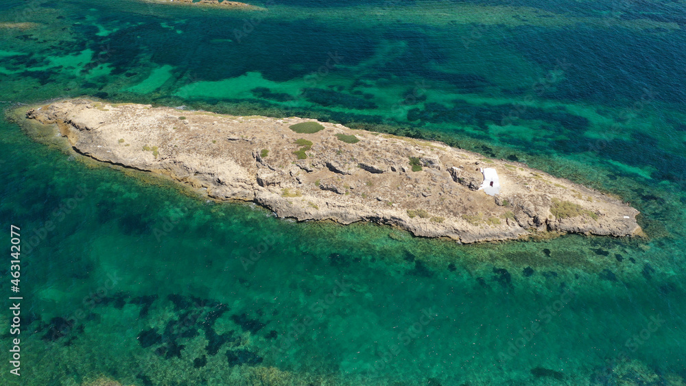 Aerial drone photo of small islet and chapel of Agios Ermolaos, Skyros island, Sporades, Greece